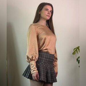 Muted blush pink satin open-back blouse